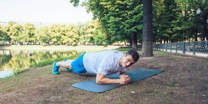 a man doing a weight loss plank